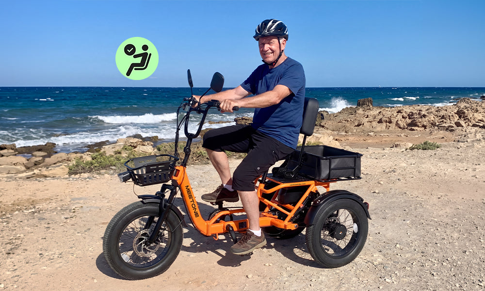 Rider on a Breeze 2.0 folding eTrike with classic semi-recumbent comfort