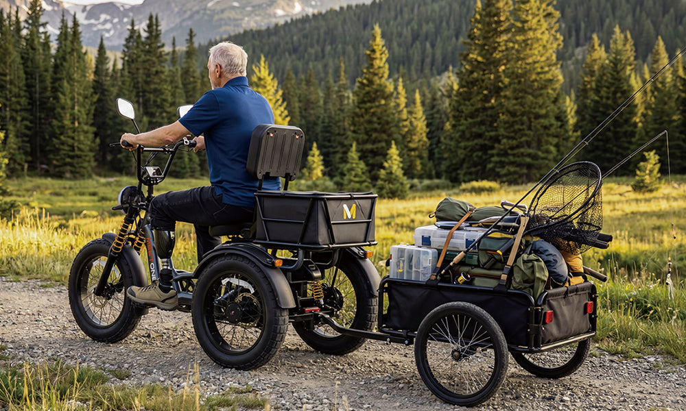 Tour Lite 2.0 eTrike towing a trailer on a mountain trail
