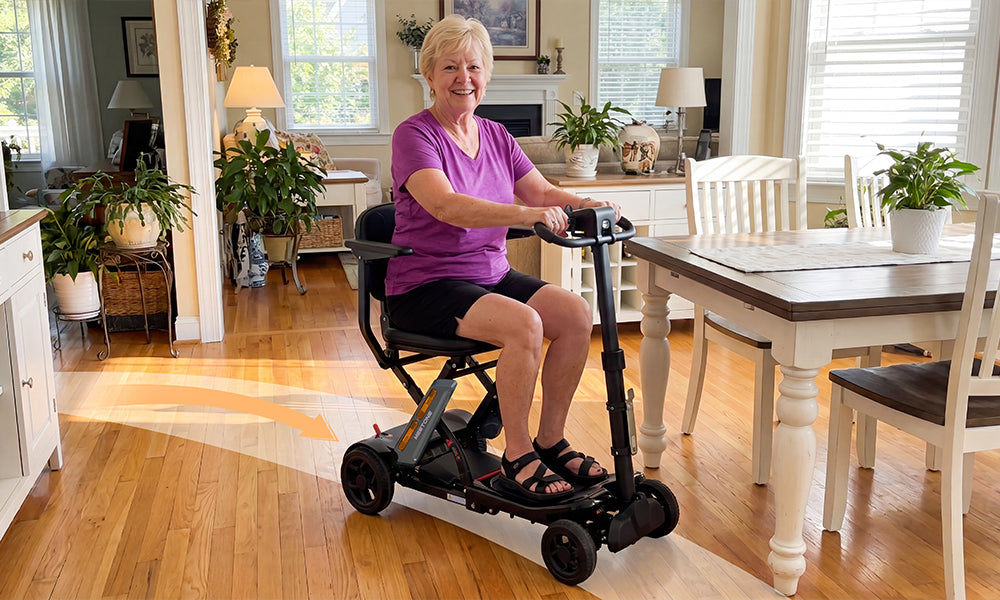 Senior woman using the Meet One Glide mobility scooter indoors at home
