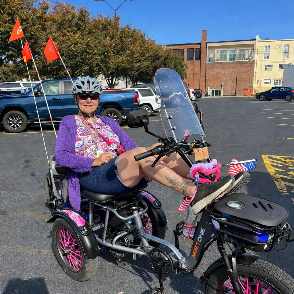Rider on a semi-recumbent electric trike set up for longer, more relaxed recreational rides